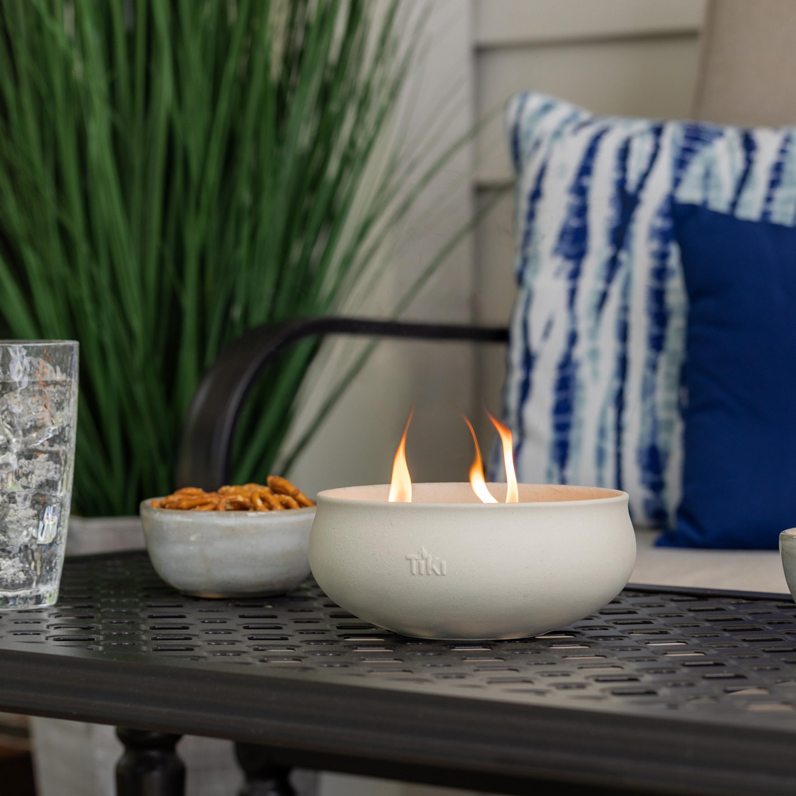TIKI 7-inch citronella candle in concrete finish suited for patio centerpieces and outdoor dining.