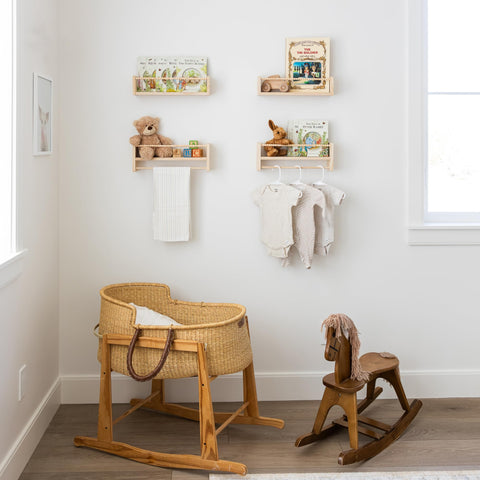 Timber And Teddy shelves with hanging rod display baby keepsakes neatly.