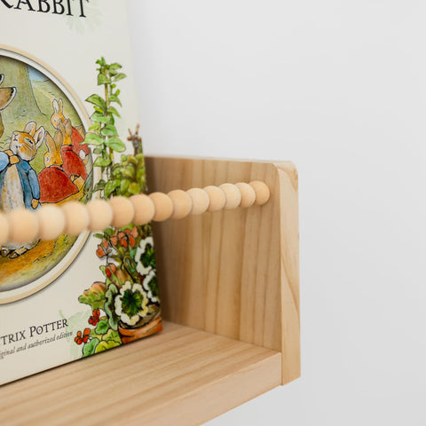 Timber And Teddy row arrangement creates tidy nursery display.