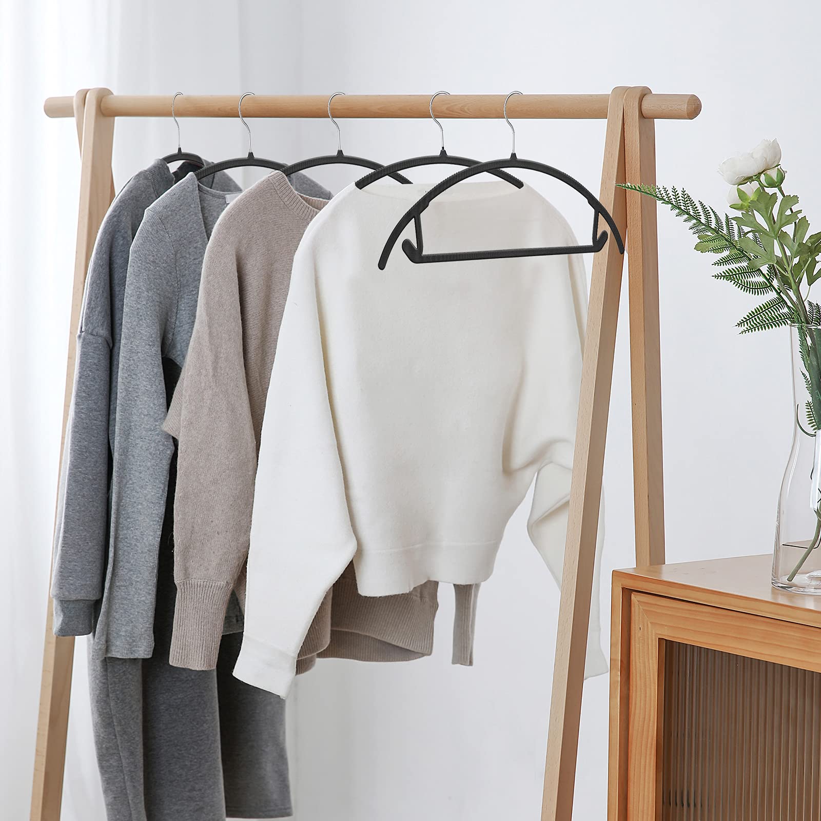 TIMMY sleek hangers save closet space while maintaining style.