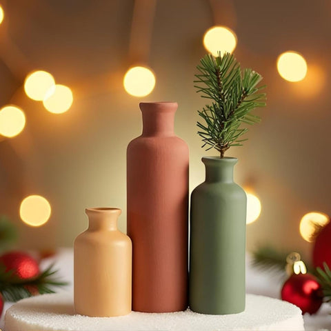 Three green mix vases grouped on a mantel offer cohesive farmhouse charm.