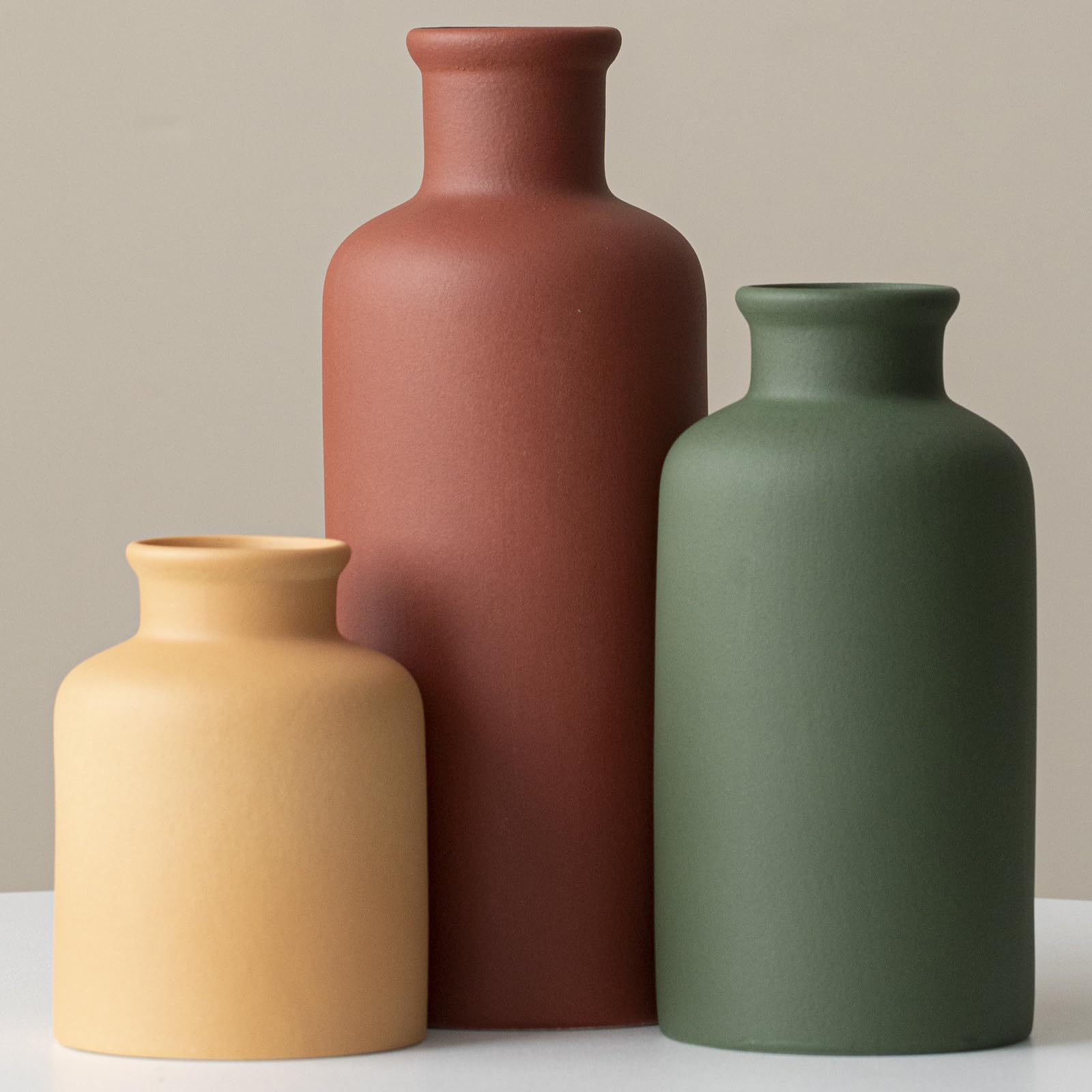 TINCTOTNIC terracotta vase on mantel adds warm focal point