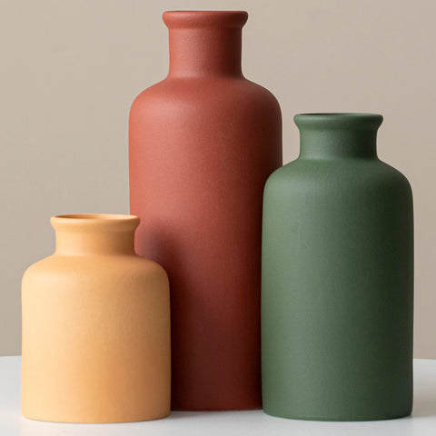 TINCTOTNIC terracotta vase on mantel adds warm focal point