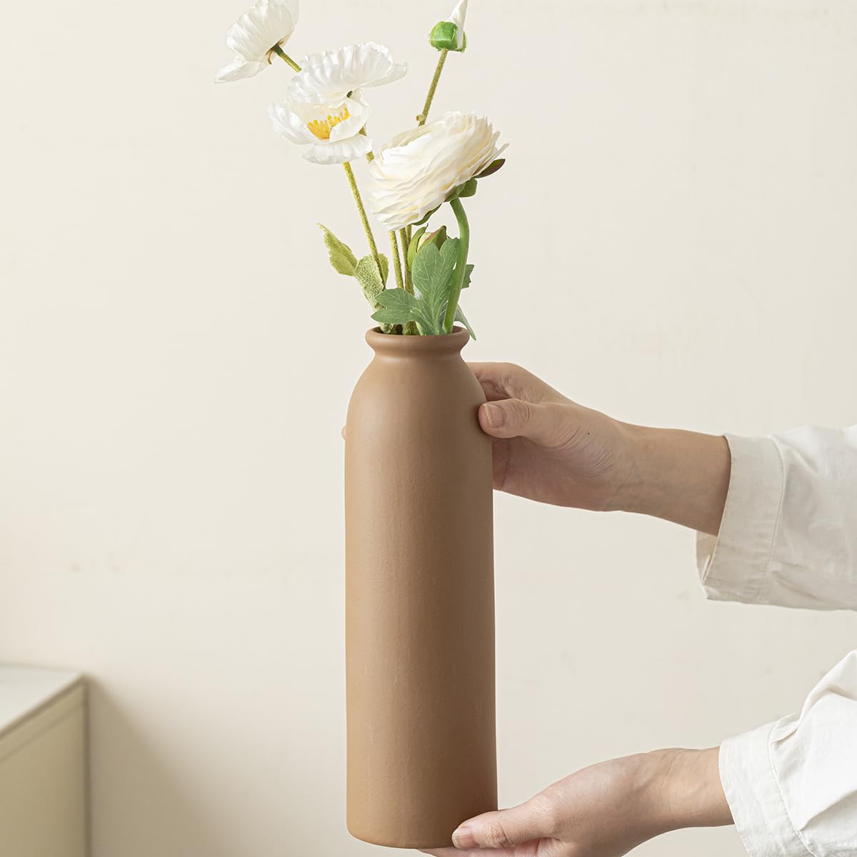 TINCTOTNIC tall white vase with handles enhances dramatic vertical arrangements