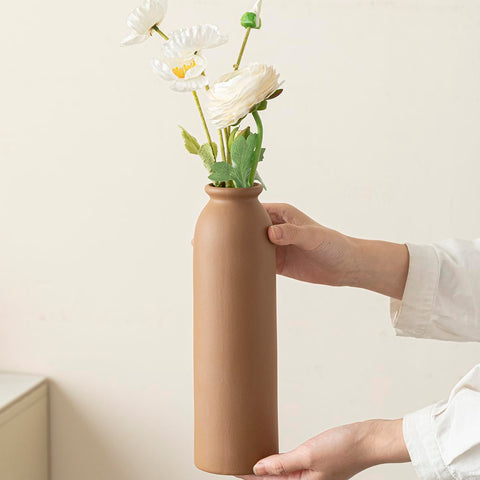 TINCTOTNIC tall white vase with handles enhances dramatic vertical arrangements