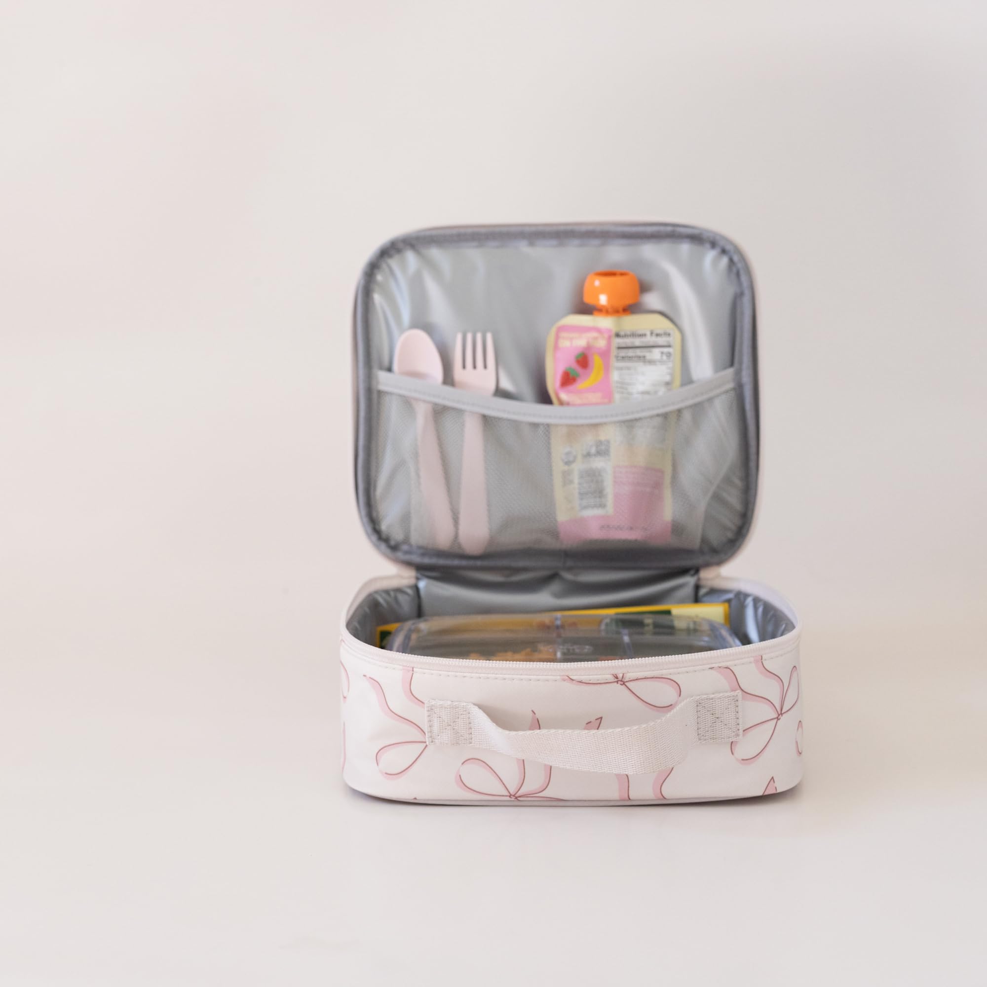 Tiny Twinkle lunch box interior wipe-clean surface ready for quick cleanup.