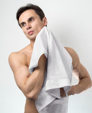 T & L Towel and Linen Mart soft-touch white bath towels.