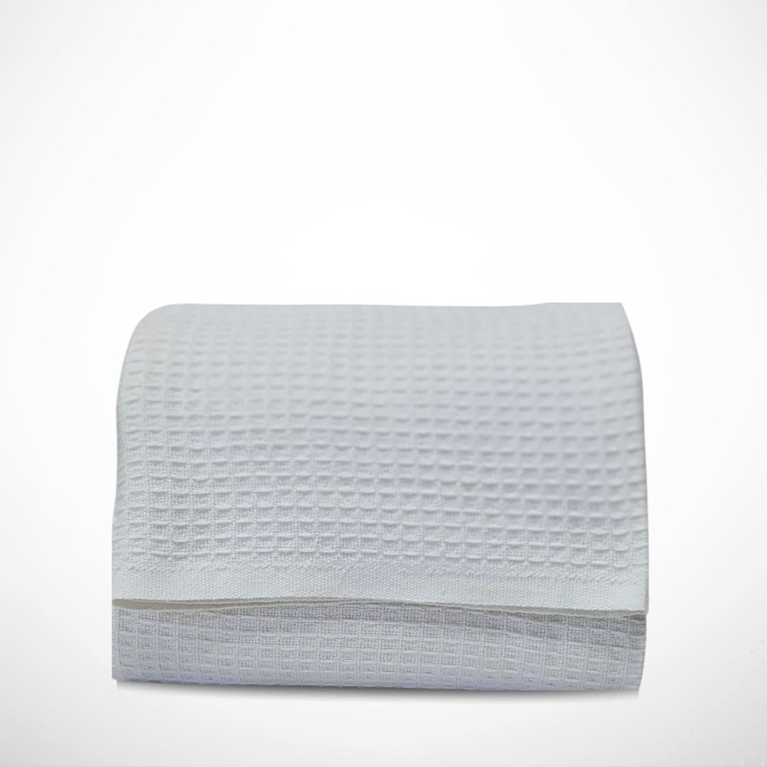 Blanket draped on bed ideal for layering on a queen size bed.