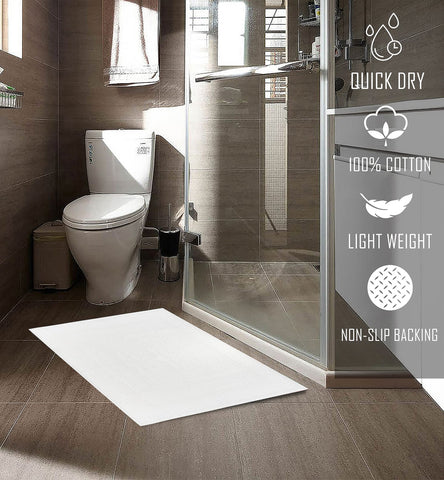 TOALLA bath mat 18x25 white folded showcases versatile space saving set