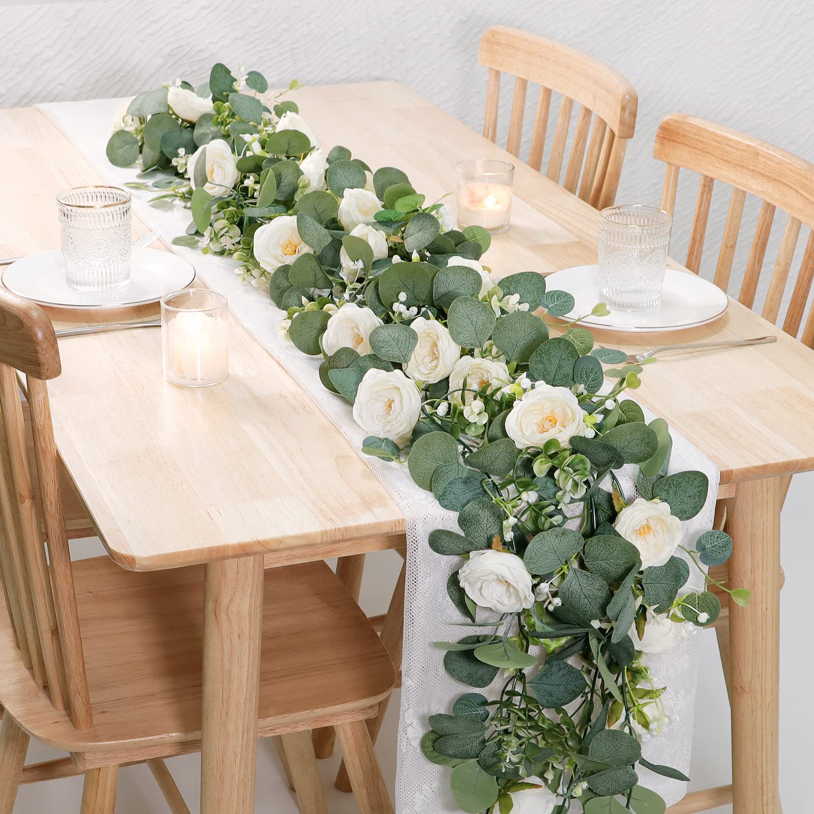 TOCHGREEN white roses garland close-up highlights dense leaves for effortless centerpieces