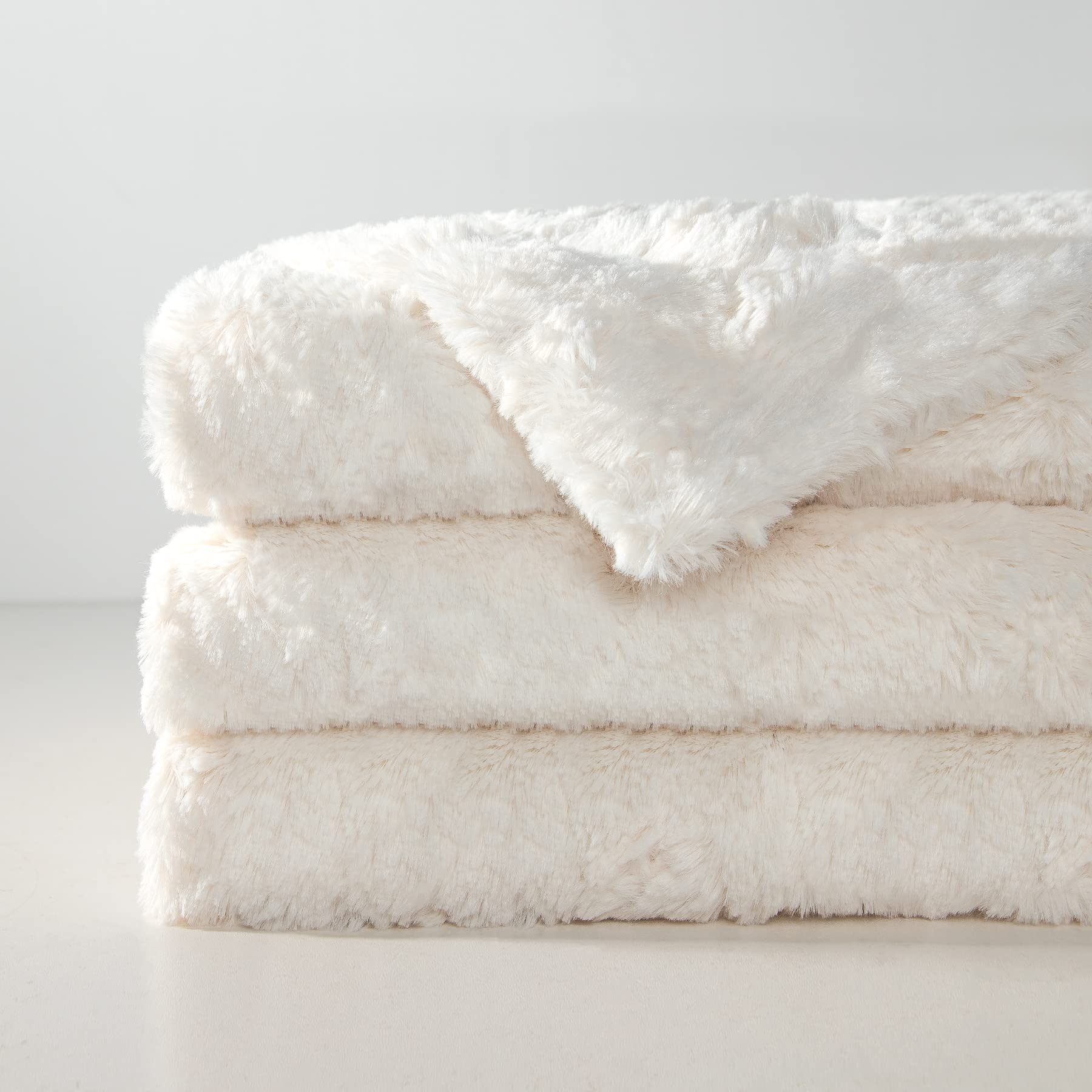 TOONOW faux fur throw cream dense plush fabric emphasizes warmth and cozy texture