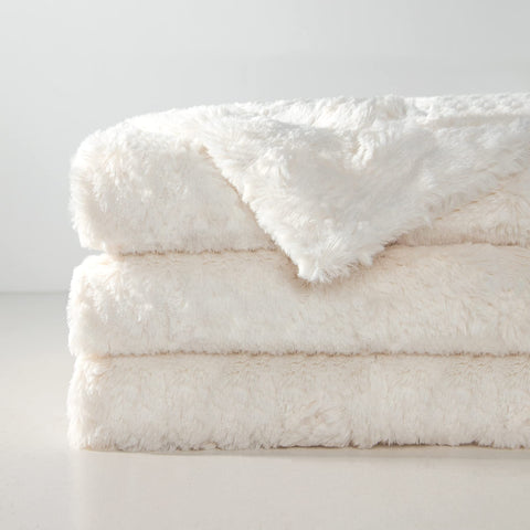 TOONOW faux fur throw cream dense plush fabric emphasizes warmth and cozy texture