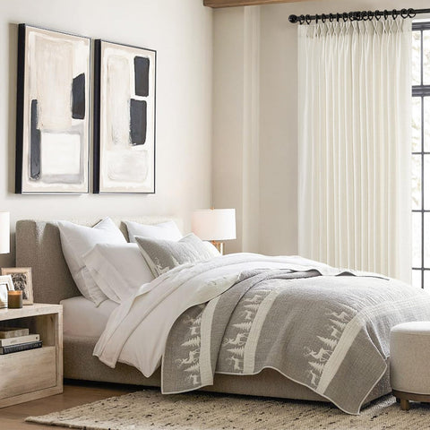 Topfinel bedroom ambience created by cream curtains and natural light.