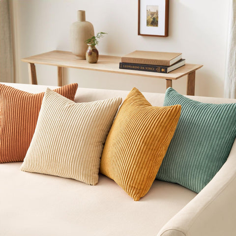 Topfinel four-pack pillow covers displayed on a sofa for quick room refresh.
