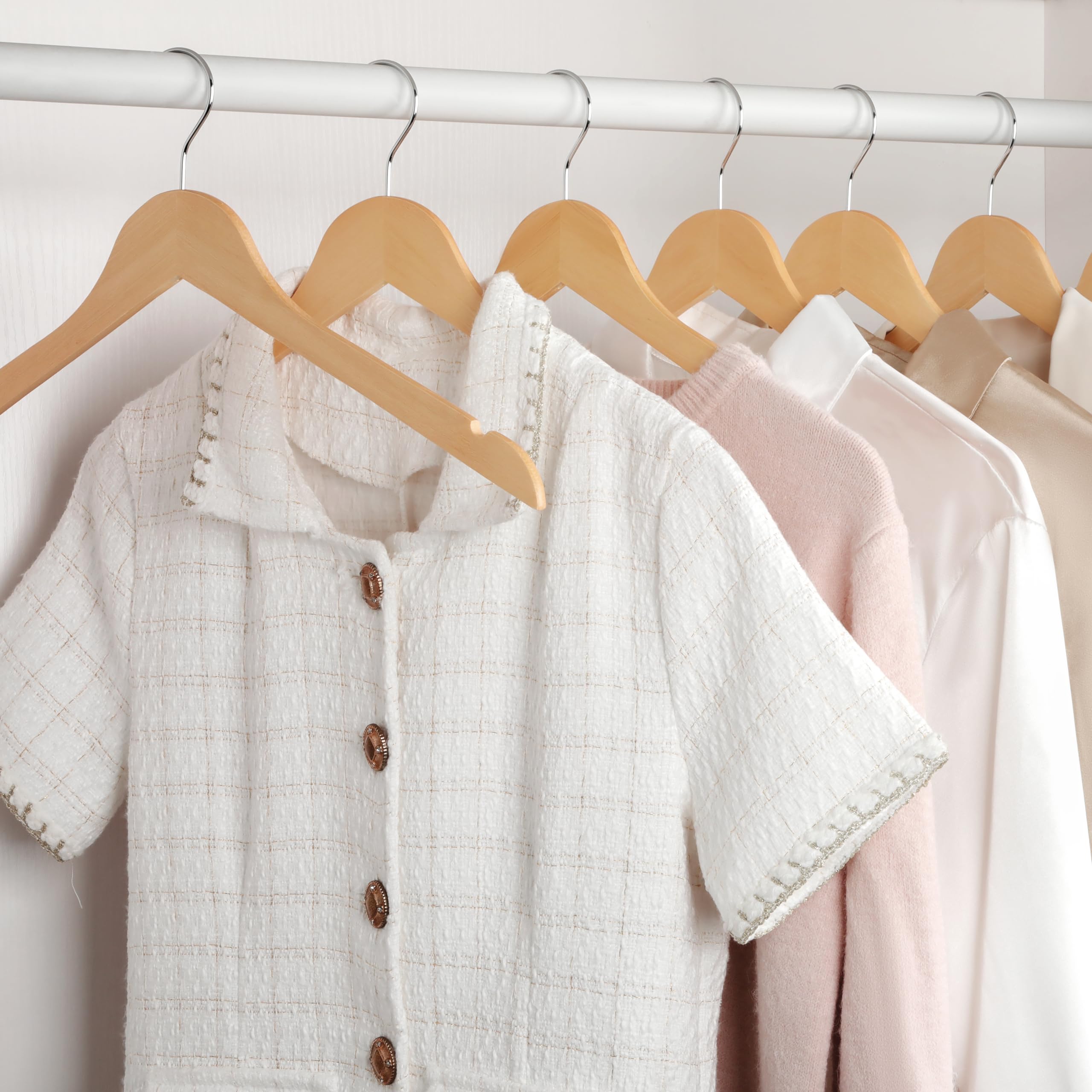 TOPIA HANGER lacquered wood finish complements any closet.