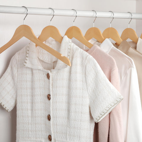 TOPIA HANGER lacquered wood finish complements any closet.