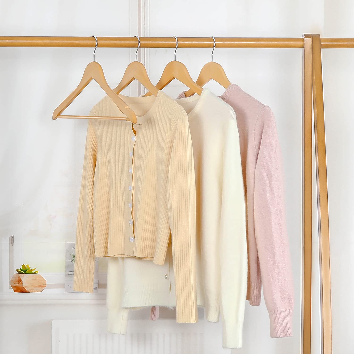 Topia Hanger shoulder notches secure delicate straps without slipping.