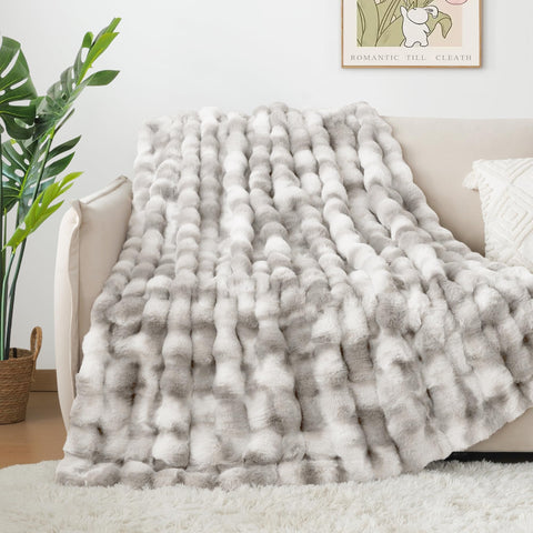 Touchat soft grey throw on sofa adding cozy decor and style