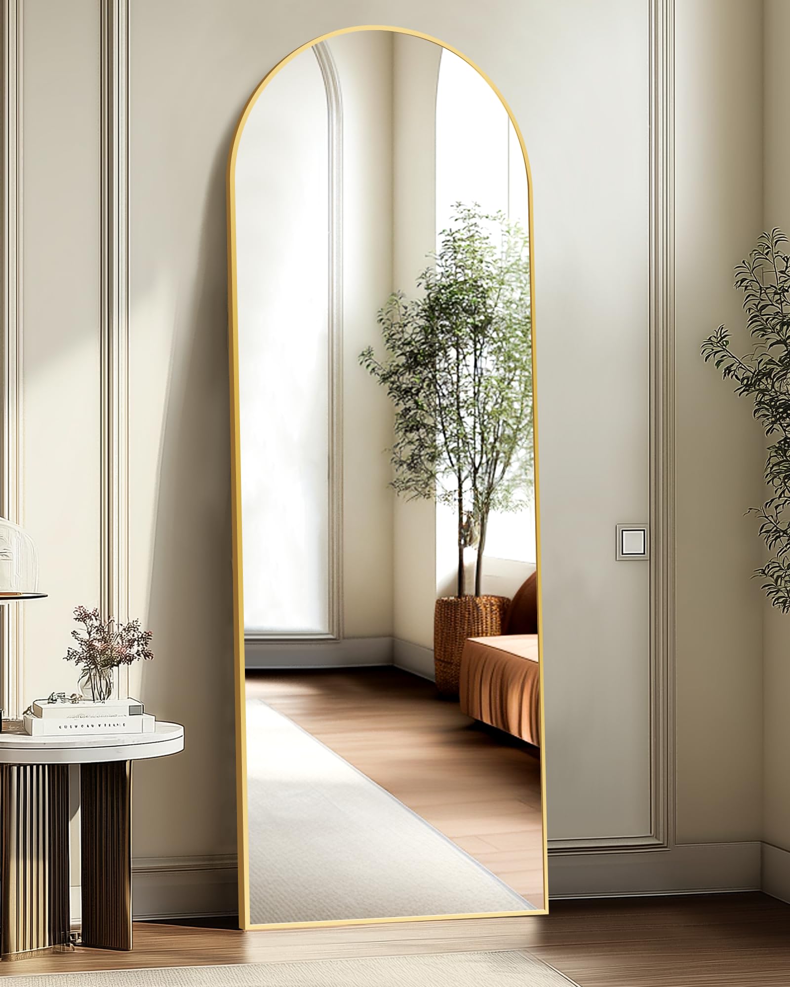 TRAHOME arched mirror front view in gold adds brightness and style.