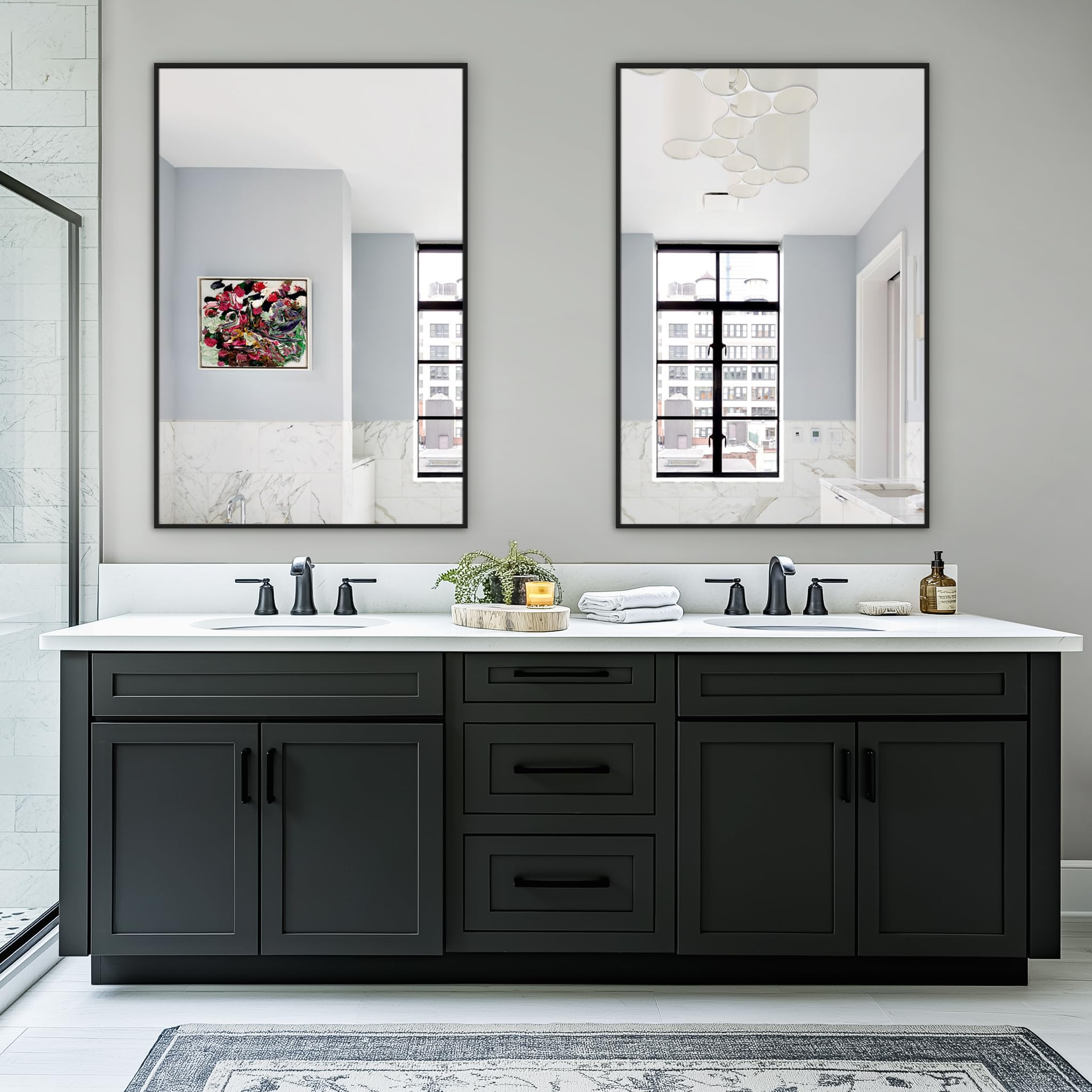 TRAHOME twin mirrors in a black metal frame add a bold focal point.