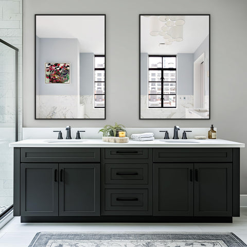 TRAHOME twin mirrors in a black metal frame add a bold focal point.