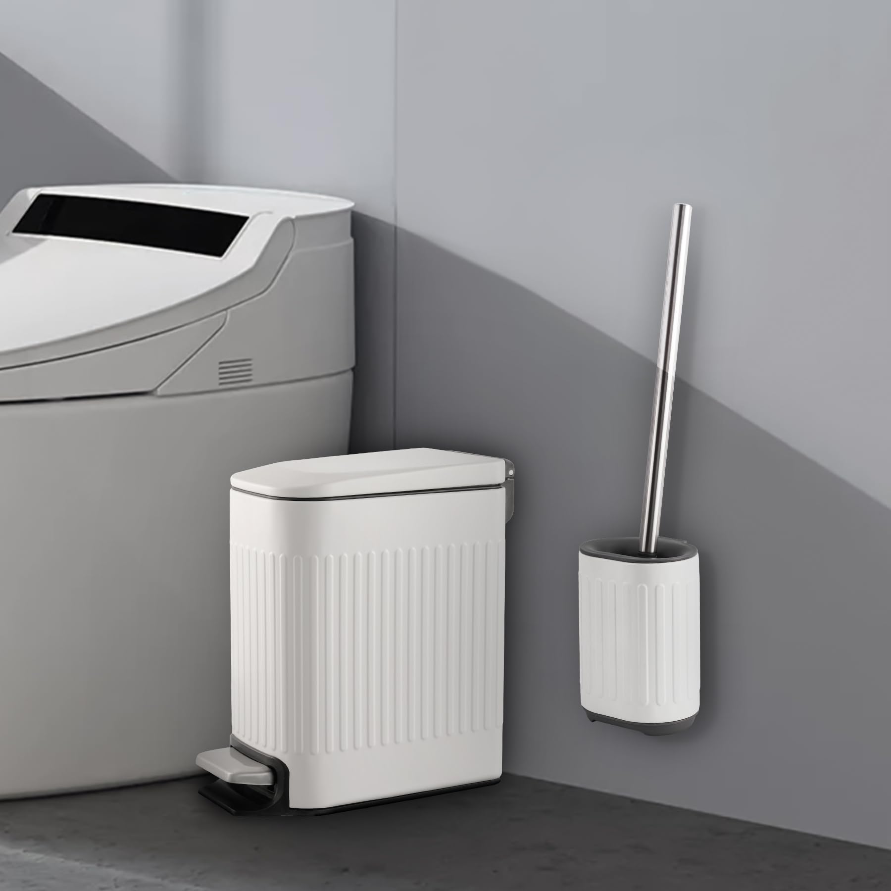 TrashAid toilet brush set with embossed metal finish.