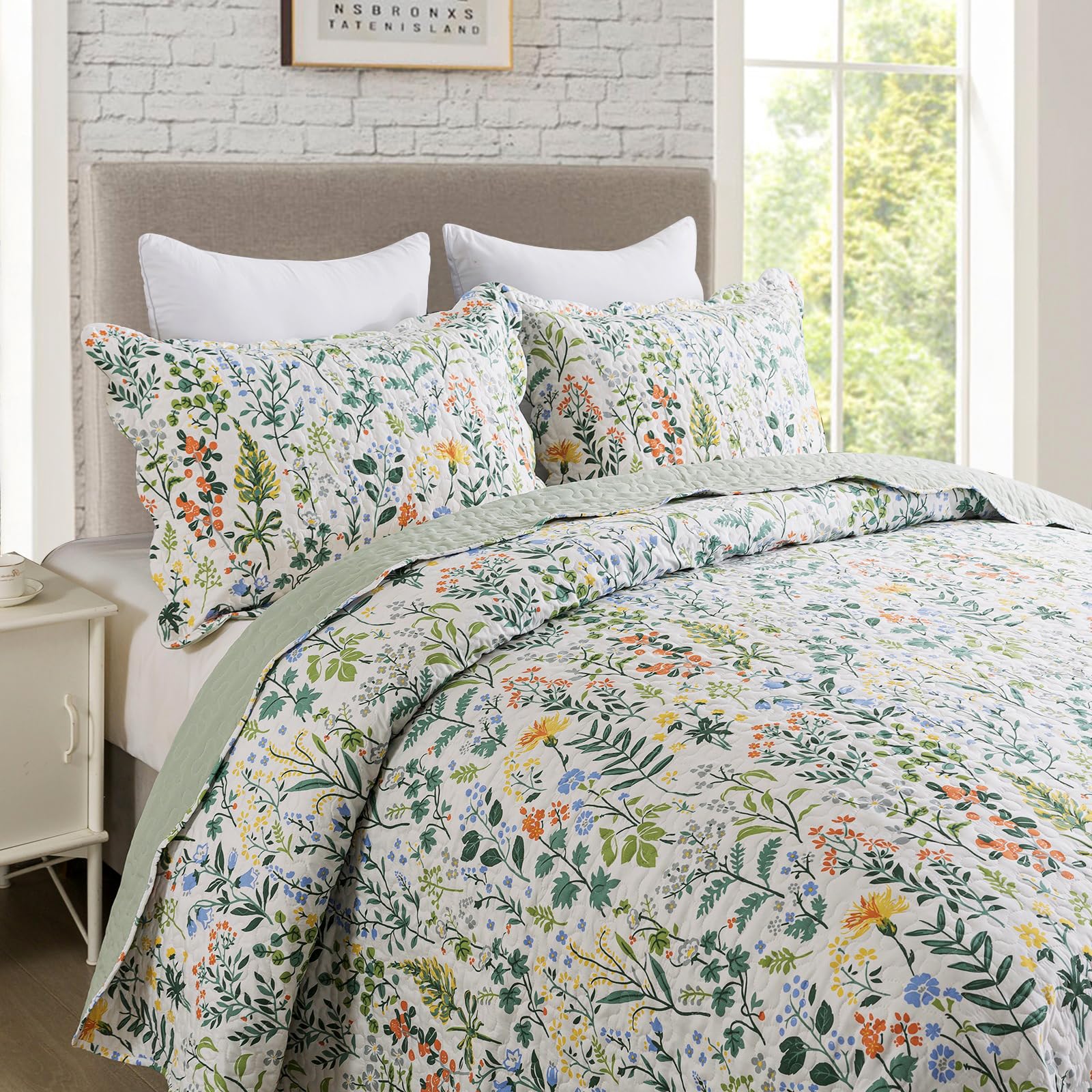 Queen-size Travan bedding on a bed with garden motif for all-season layering.
