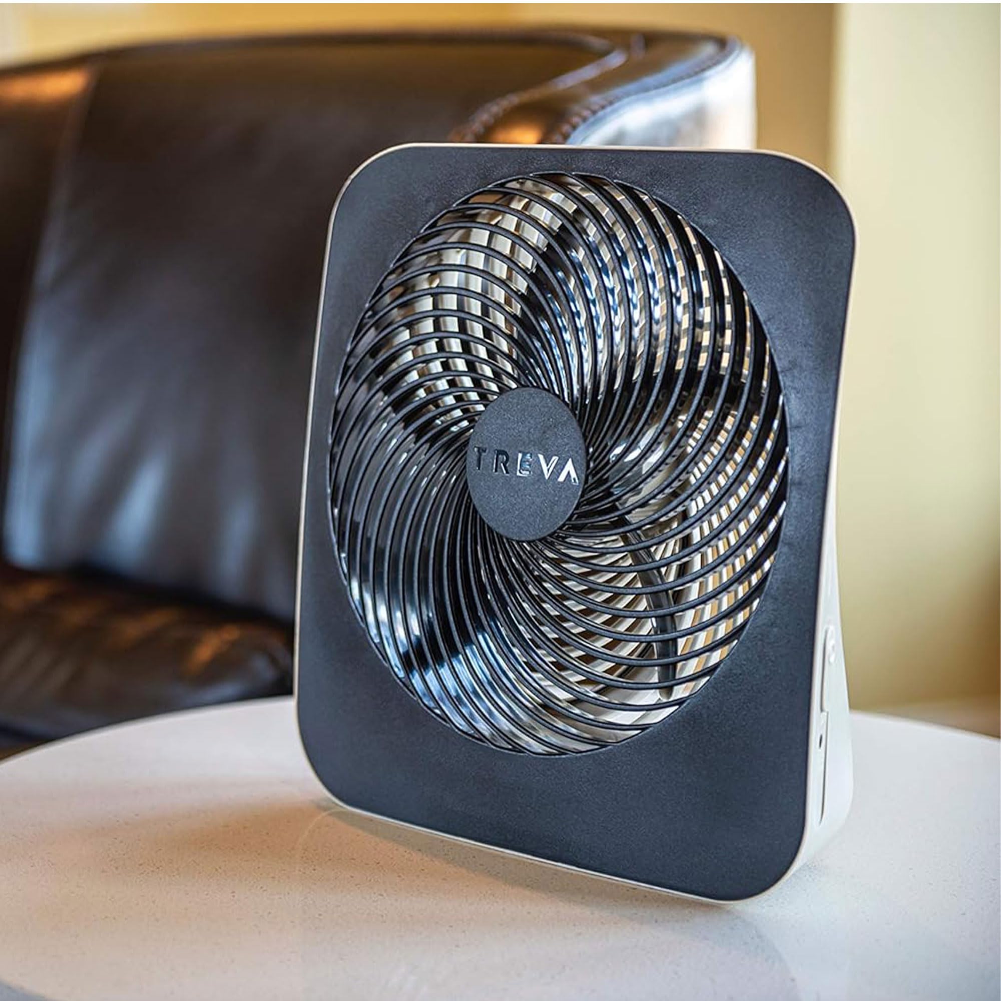 Treva 10-inch fan front view showing compact desk footprint.