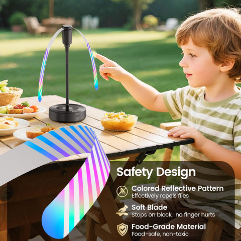 TriPole fly fan hanging from a patio umbrella for outdoor dining.