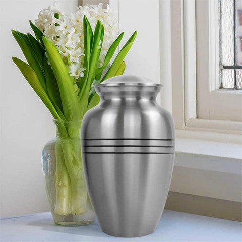 Trupoint Memorials display-ready urn in silver-gray finish for mantles.