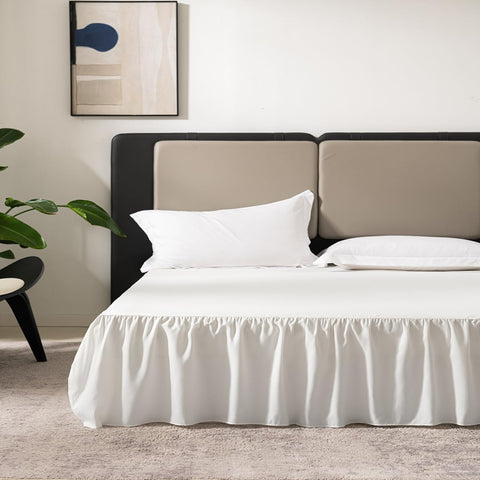 TSUTOMI ivory ruffled bed skirt, side view, adds elegant concealment under the bed.