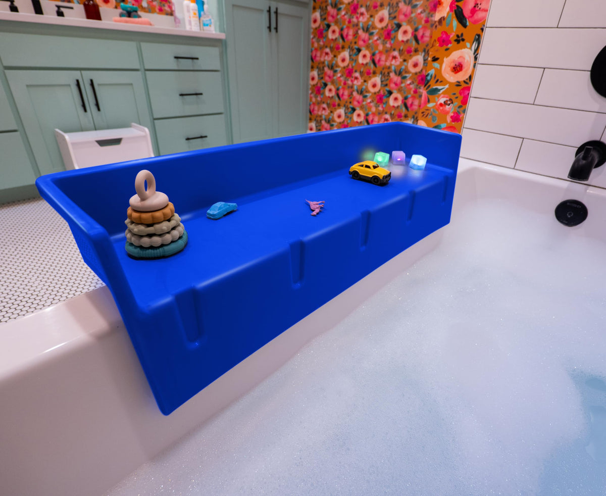 Tub Topper splash guard in blue keeping water in the tub for less mess