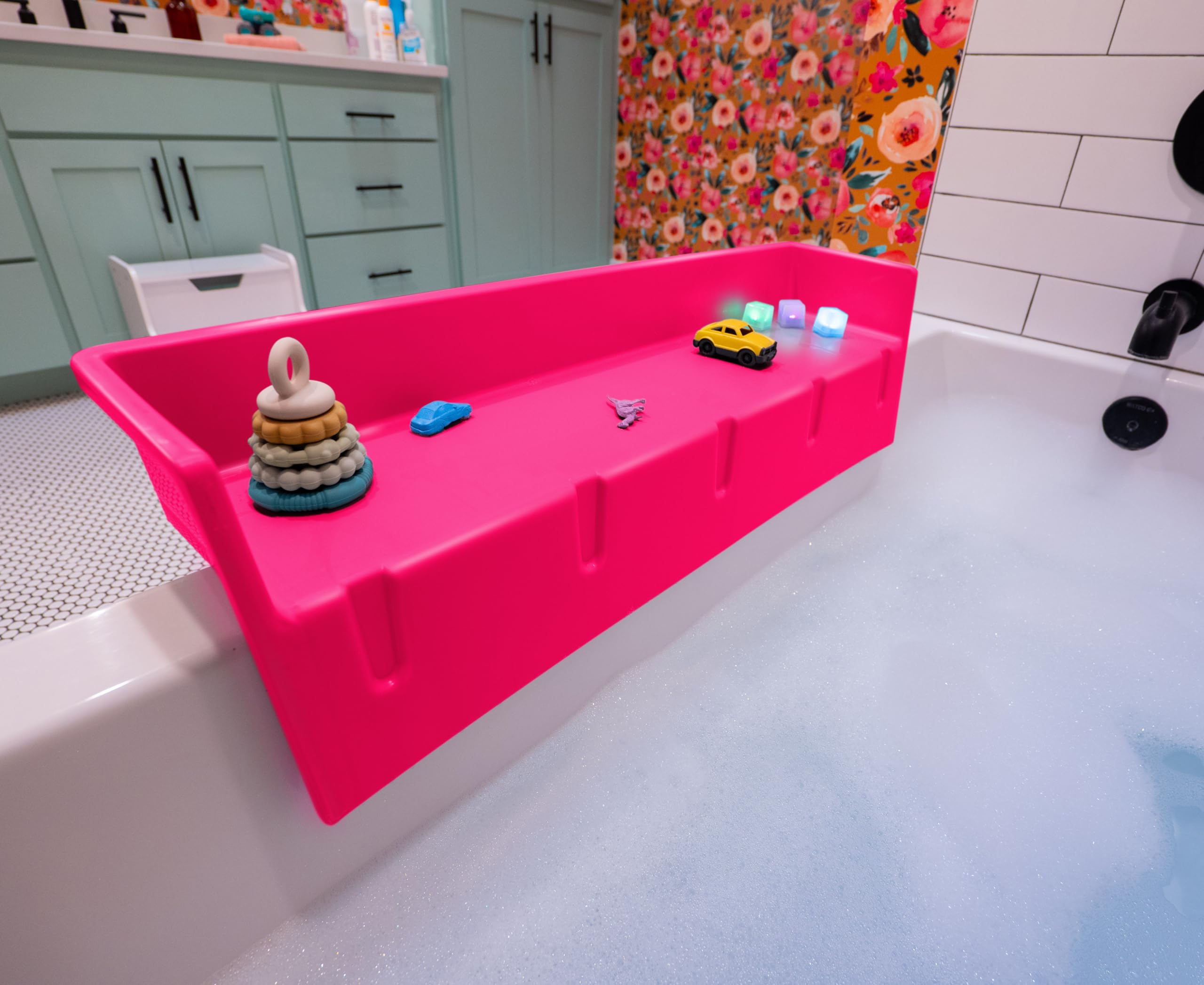 Tub Topper pink bathtub splash guard showing water containment and tidy edge.
