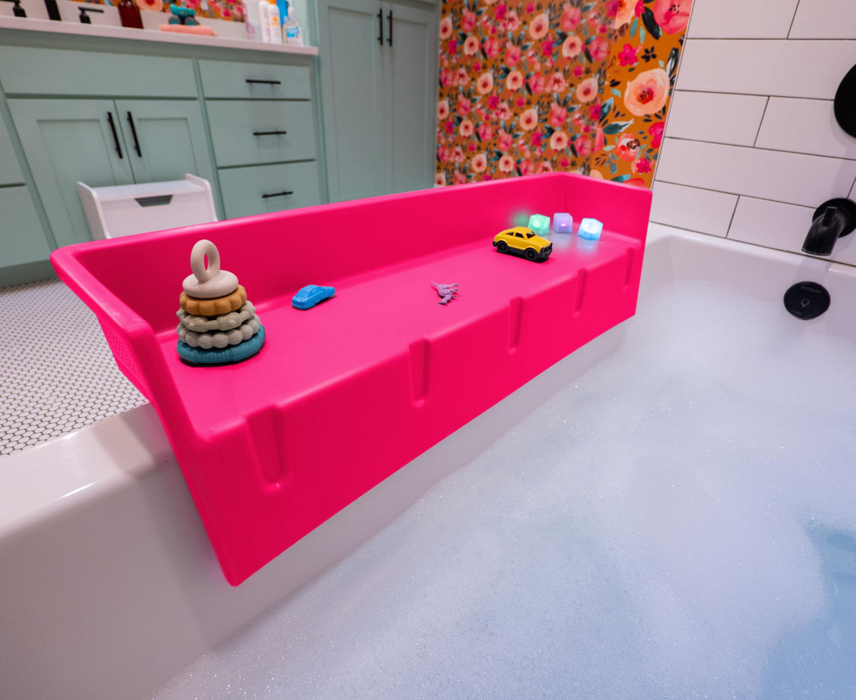 Tub Topper pink bathtub splash guard showing water containment and tidy edge.