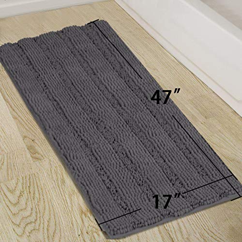 Turquoize striped-pattern chenille rug adds subtle texture to bathroom decor.