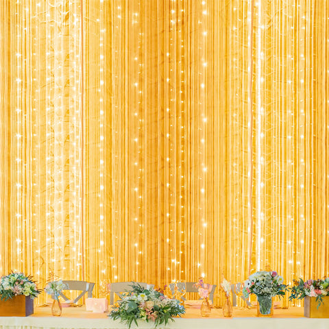 Twinkle Star 600 LED curtain lights on a window creating a magical festive ambiance.