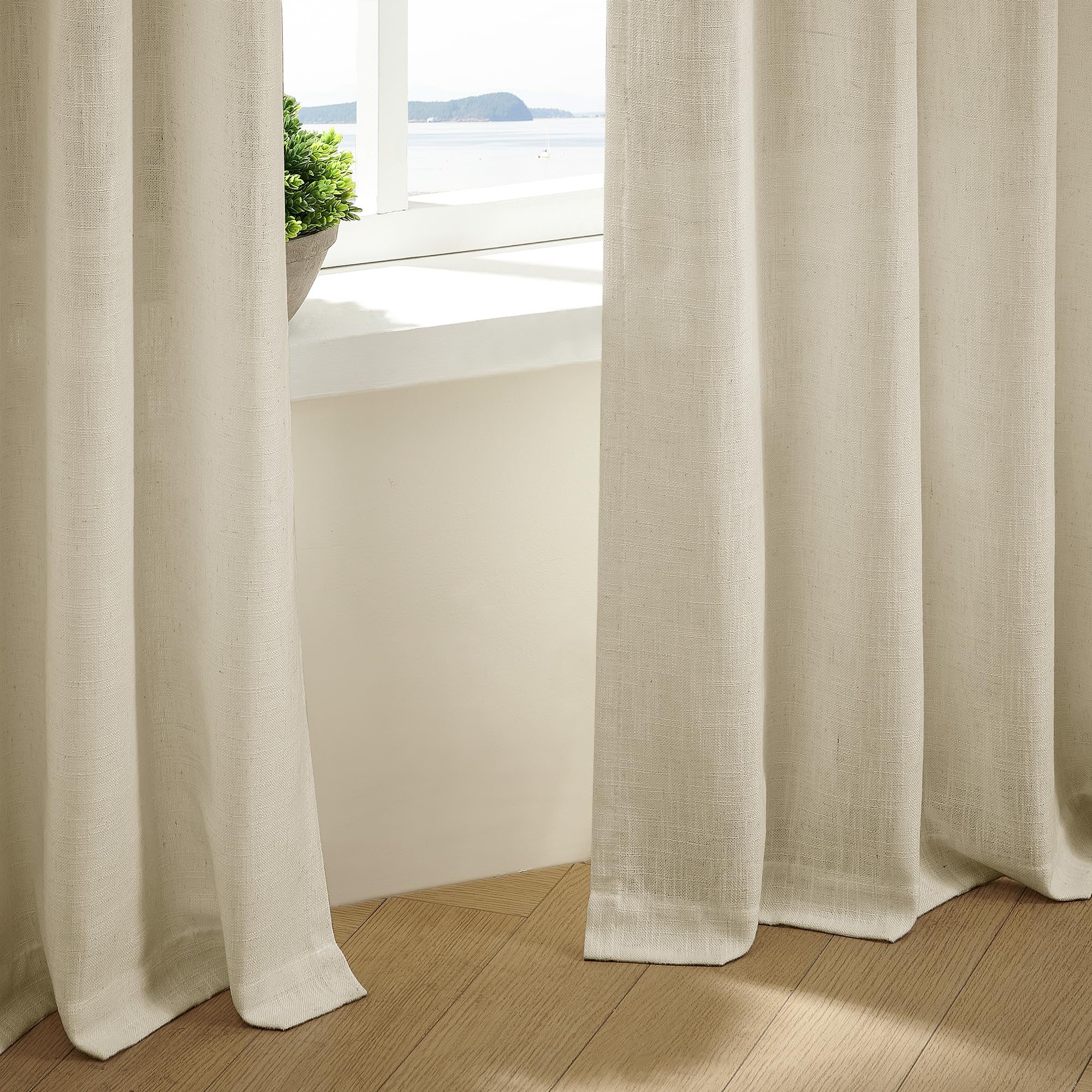 TWODRAPES beige farmhouse curtains add warmth and a soft, inviting ambiance
