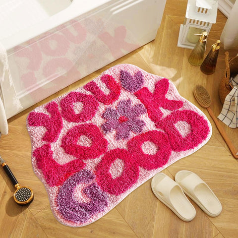 TWWDE AUG You Look Good bath rug with pink flower design adds cheerful style to your bathroom.