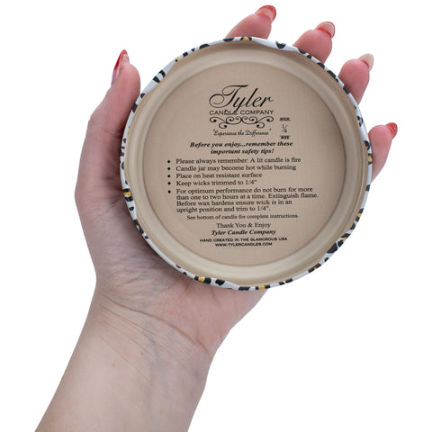 Tyler Candle High Maintenance Lit Glow evokes warm, inviting atmosphere.