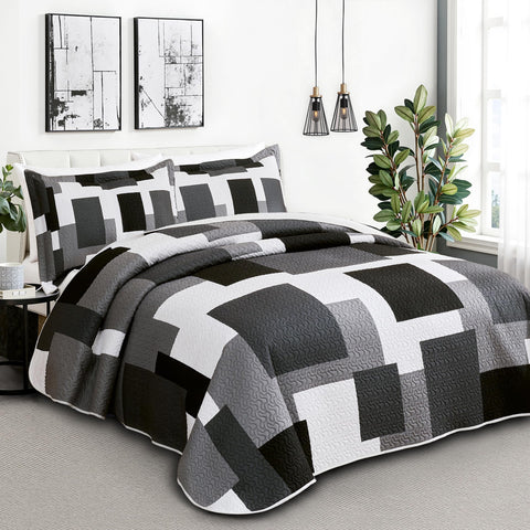 Tyrot geometric quilt with shams adds contemporary sophistication to bedrooms.