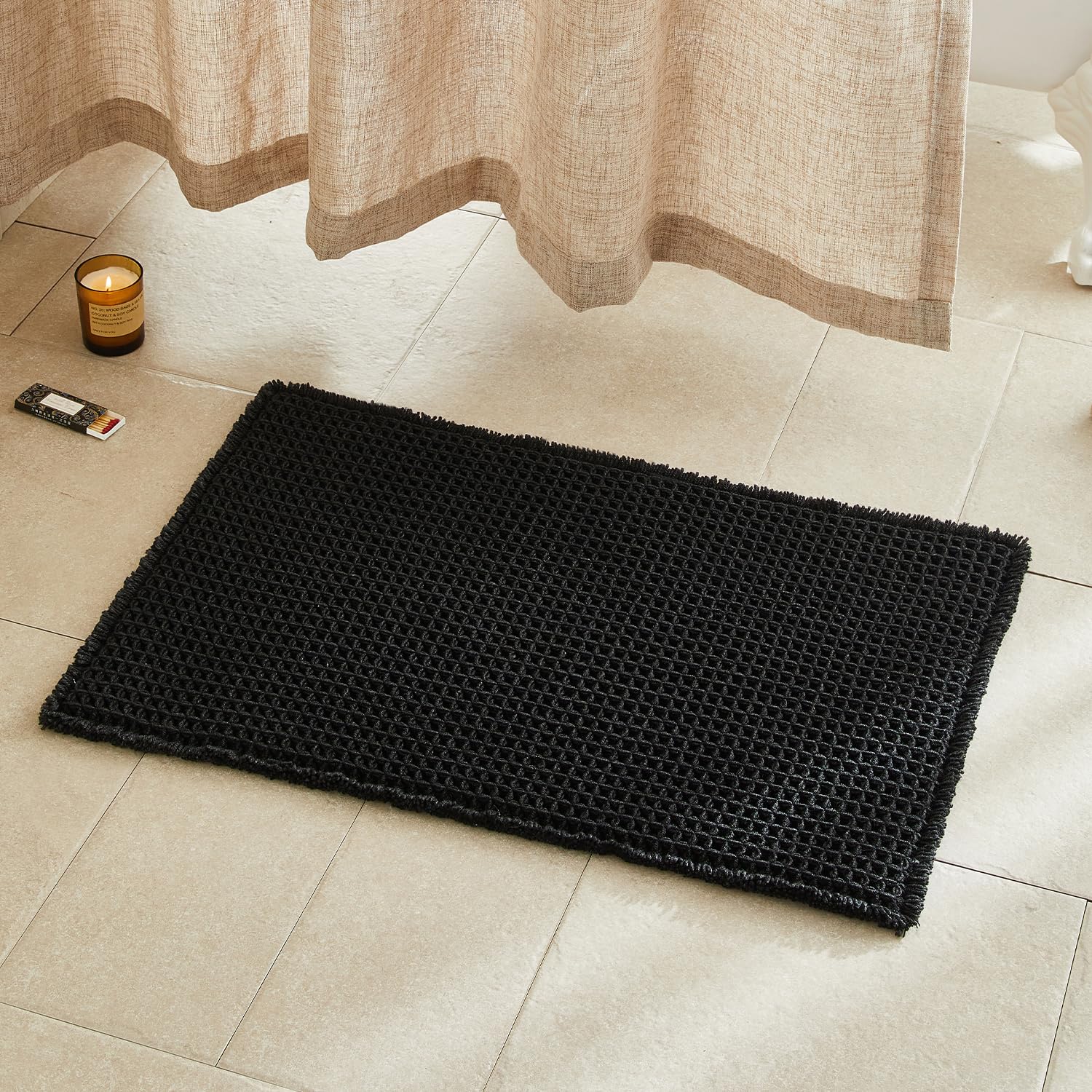 TYUU black bathroom rug with waffle texture for plush step comfort and quick drying.