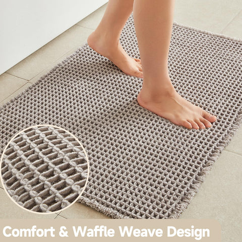 TYUU non-slip backing keeps this mat secure on smooth bathroom floors.