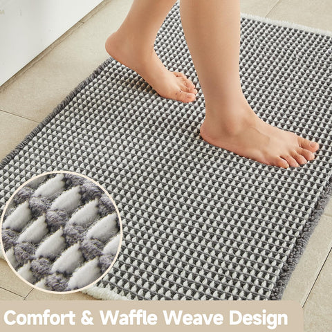 TYUU waffle bath mat absorbs water quickly to keep bath area dry