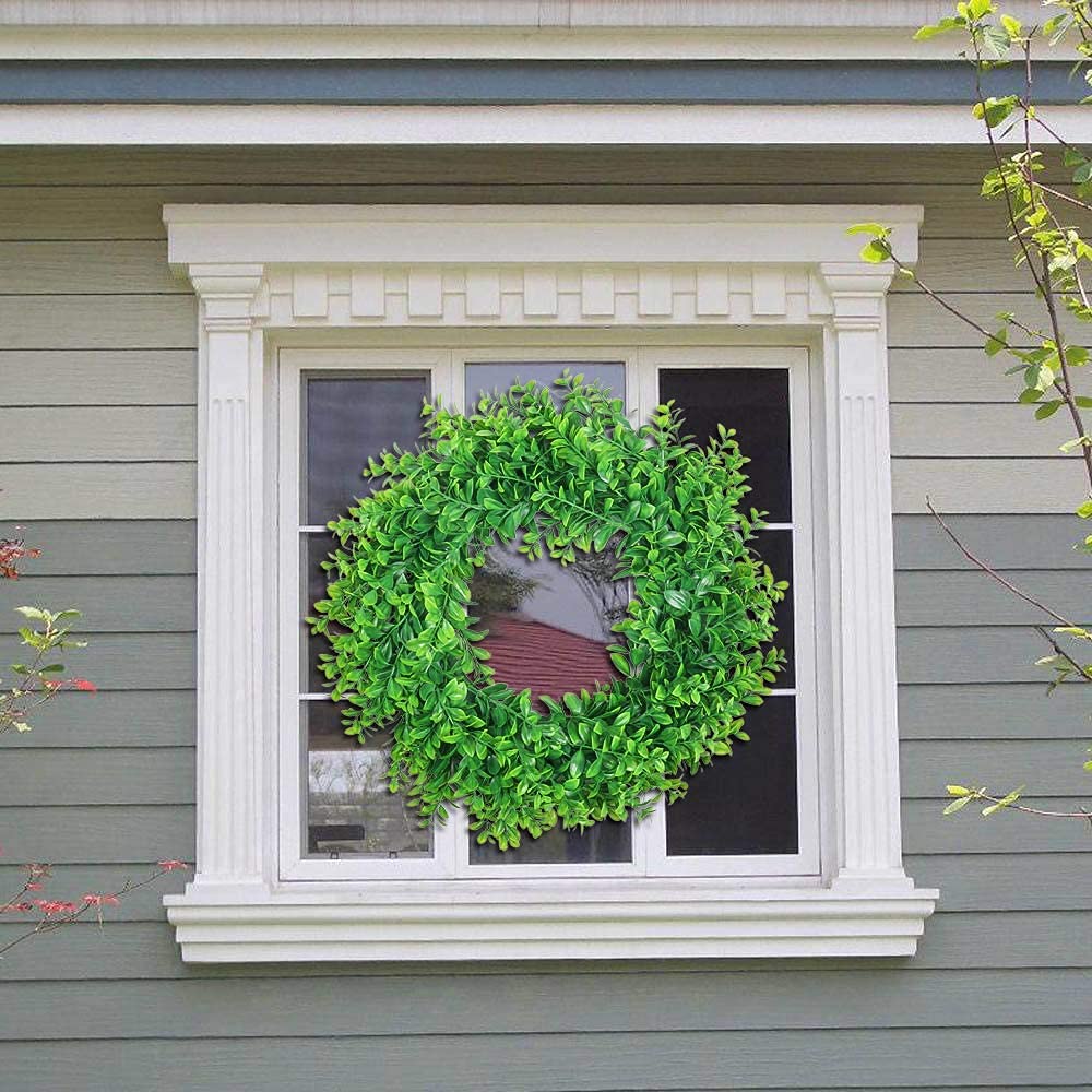U'Artlines boxwood wreath shows durable plastic construction for lasting use.