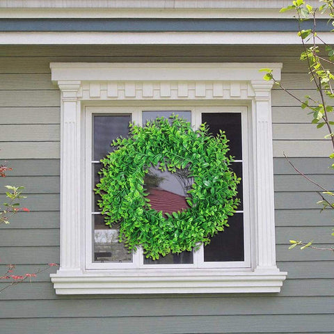 U'Artlines boxwood wreath shows durable plastic construction for lasting use.