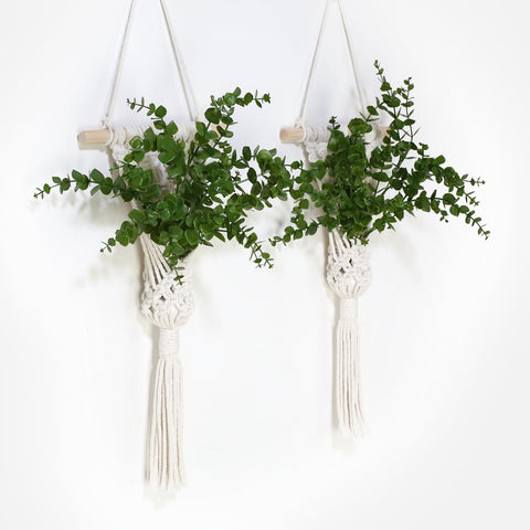 UBOSU macrame wall hanging with LED lights and wooden dowel for warm ambience.