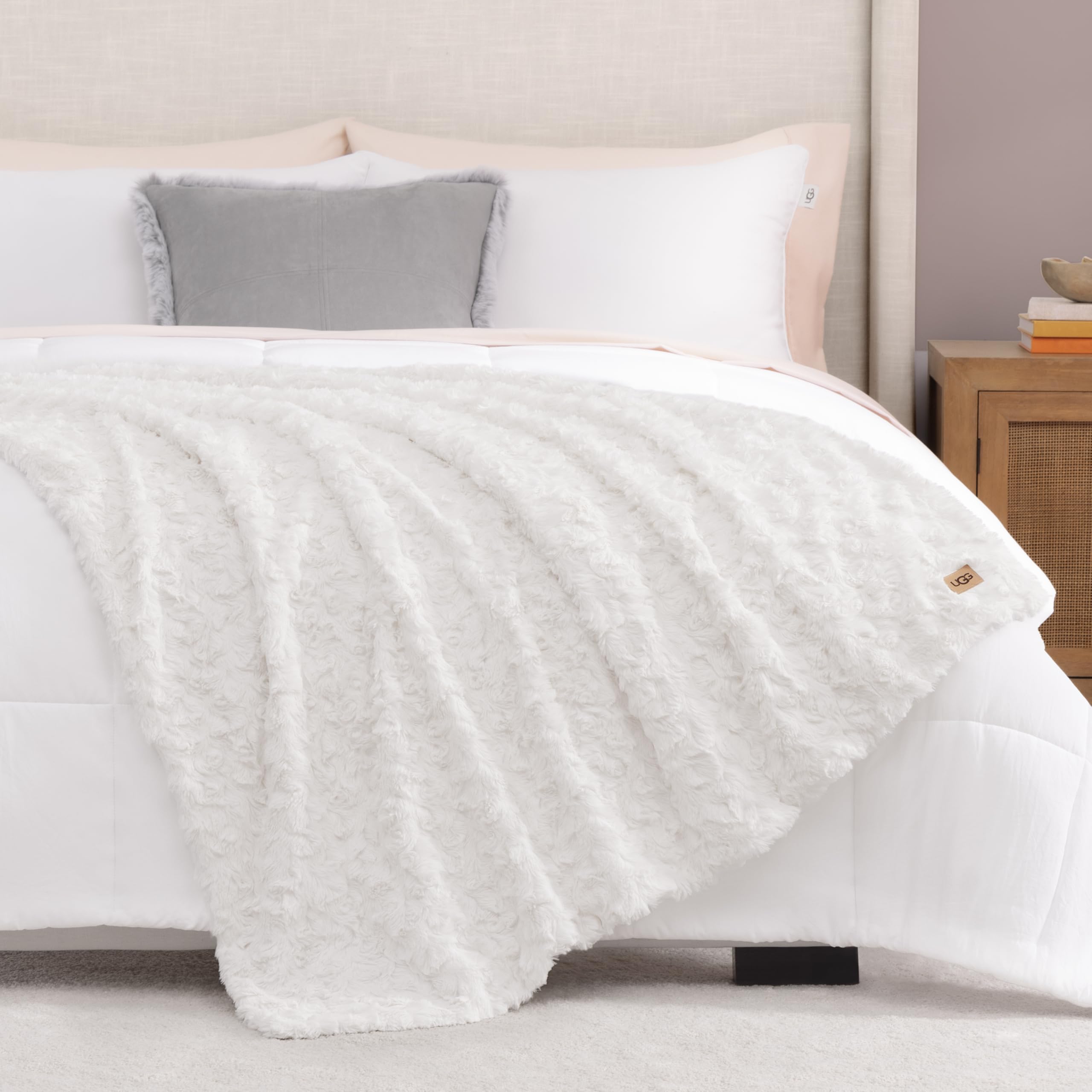UGG Adalee white throw complements beds and couches with neutral chic.
