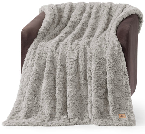 UGG Adalee wave texture throw on a couch for cozy, lightweight warmth.