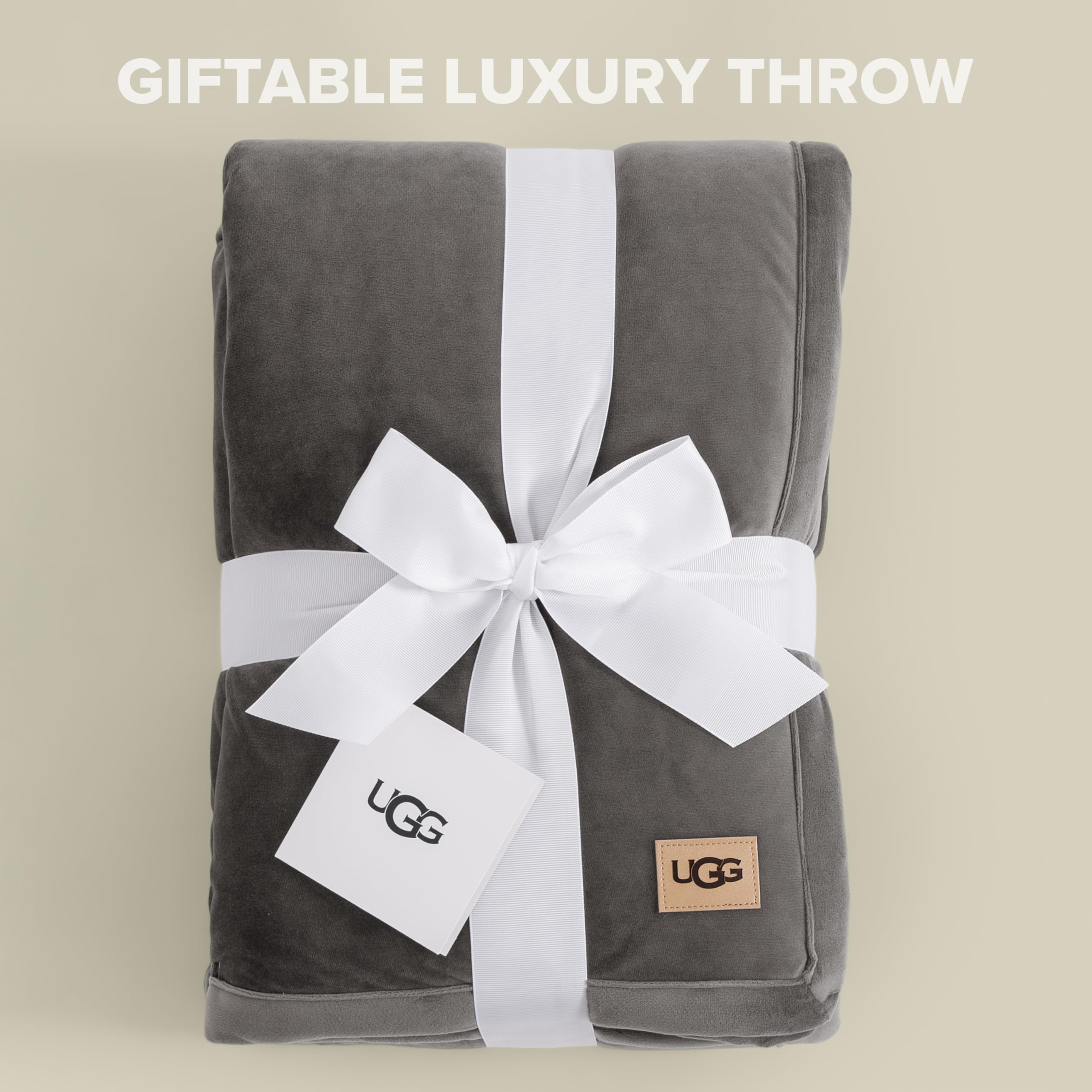 UGG Bliss Throw Blanket 50x70 size displayed on a sofa