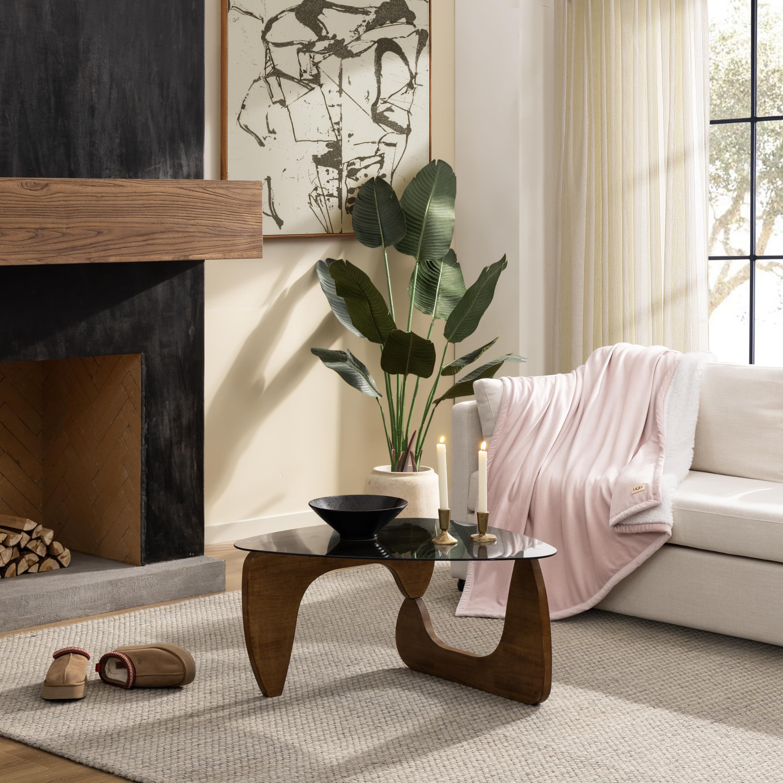 UGG Bliss Throw Blanket light pink fleece side adds soft warmth to seating areas.